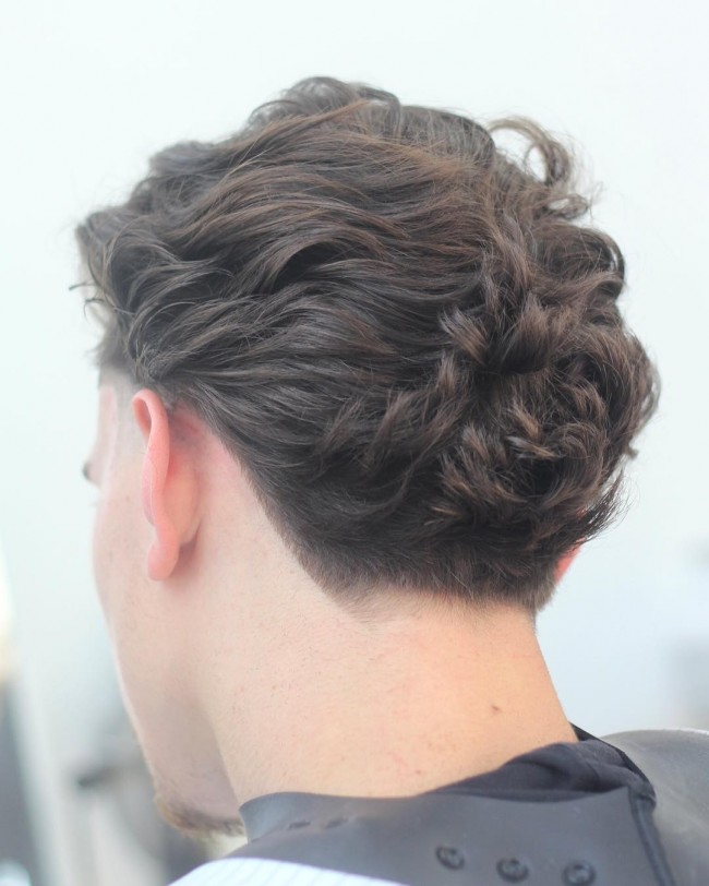 Long curly hair + fade at the nape of the neck